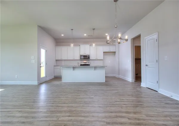 a view of kitchen with wooden floor