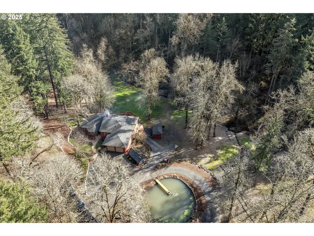 a backyard of a house with a yard and outdoor seating