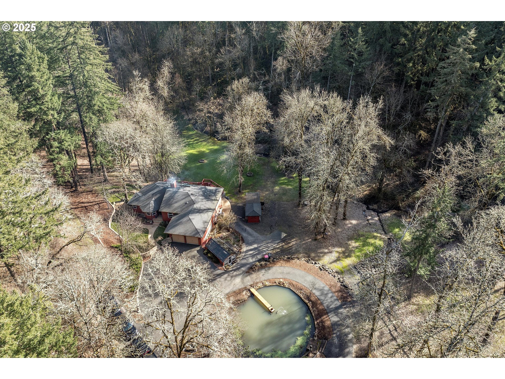 a backyard of a house with a yard and outdoor seating