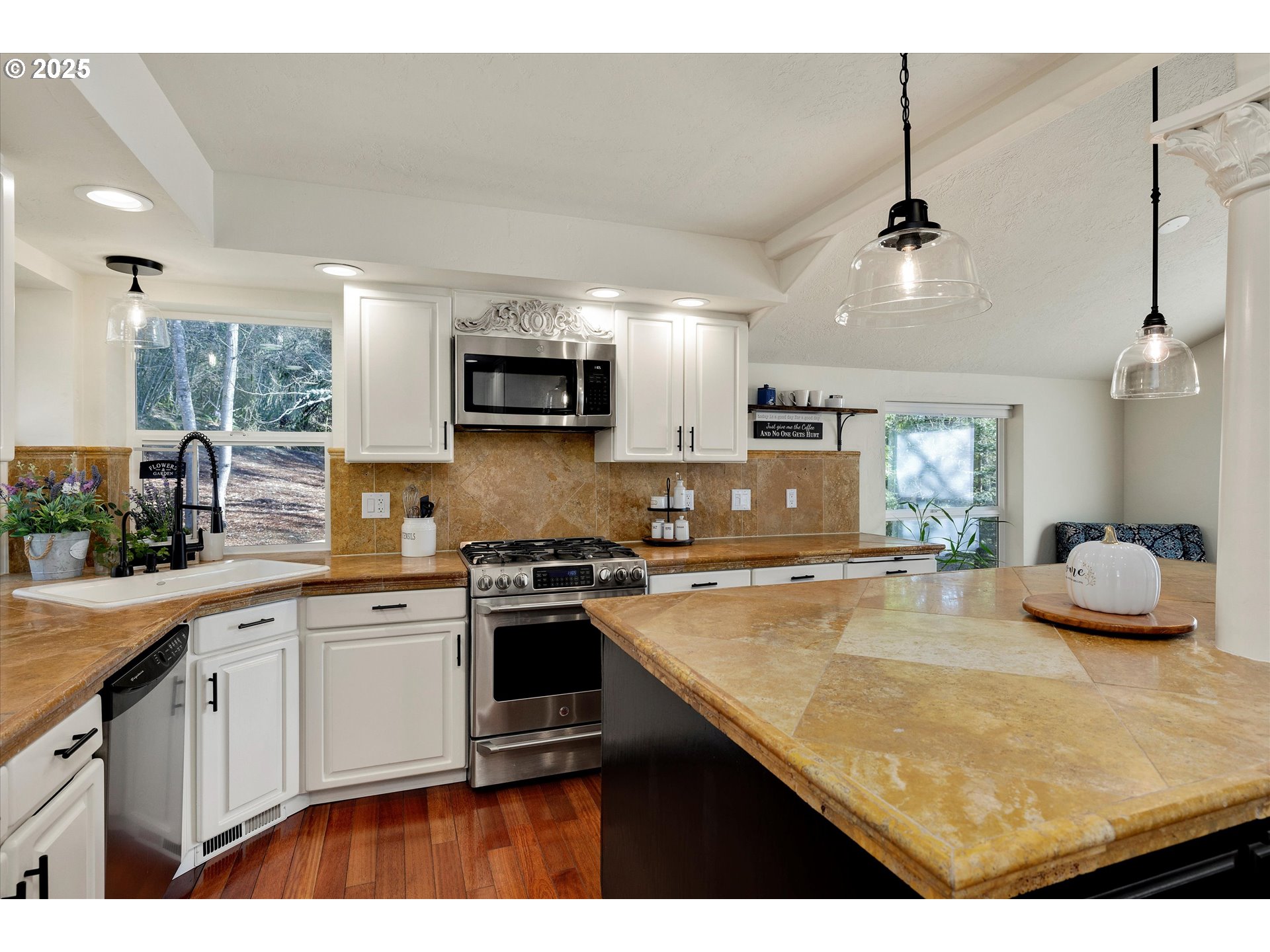 15451 Southeast Woodland Heights Road Amity, OR 97101 - Photo 14 of 48 a kitchen with kitchen island granite countertop a sink counter top space appliances and cabinets