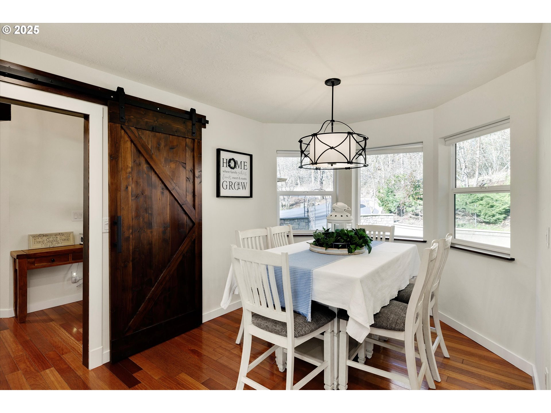 15451 Southeast Woodland Heights Road Amity, OR 97101 - Photo 15 of 48 a view of a dining room with furniture window and wooden floor
