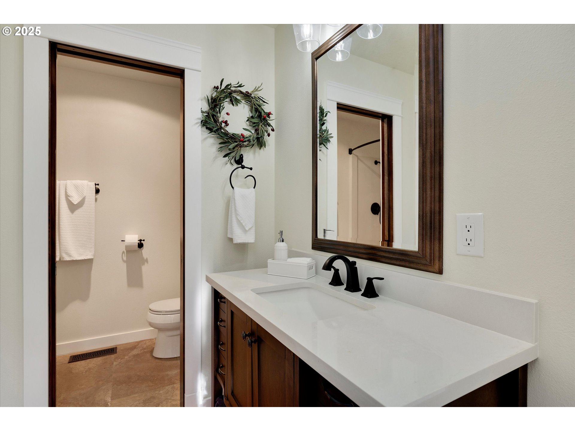 15451 Southeast Woodland Heights Road Amity, OR 97101 - Photo 17 of 48 a bathroom with a sink a toilet and a large mirror