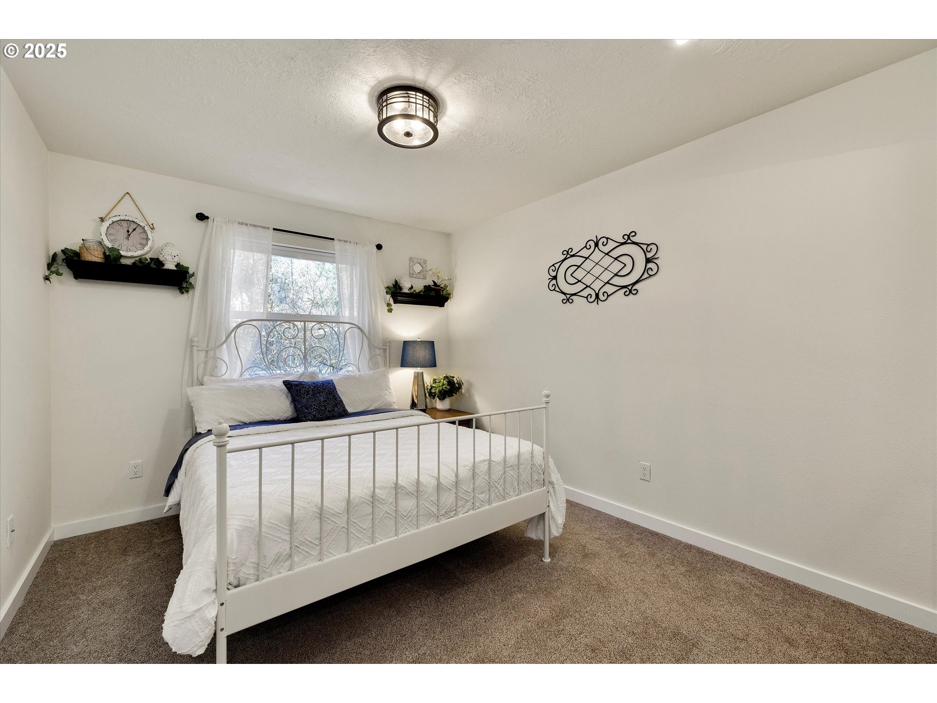 15451 Southeast Woodland Heights Road Amity, OR 97101 - Photo 20 of 48 a bedroom with a bed and window