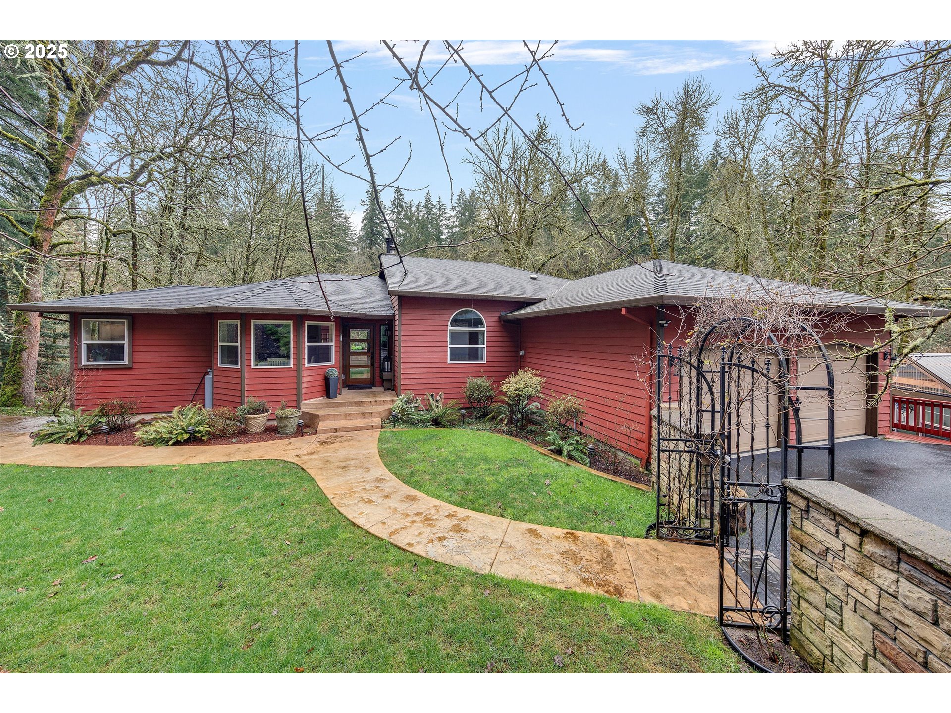 15451 Southeast Woodland Heights Road Amity, OR 97101 - Photo 2 of 48 a front view of a house with garden