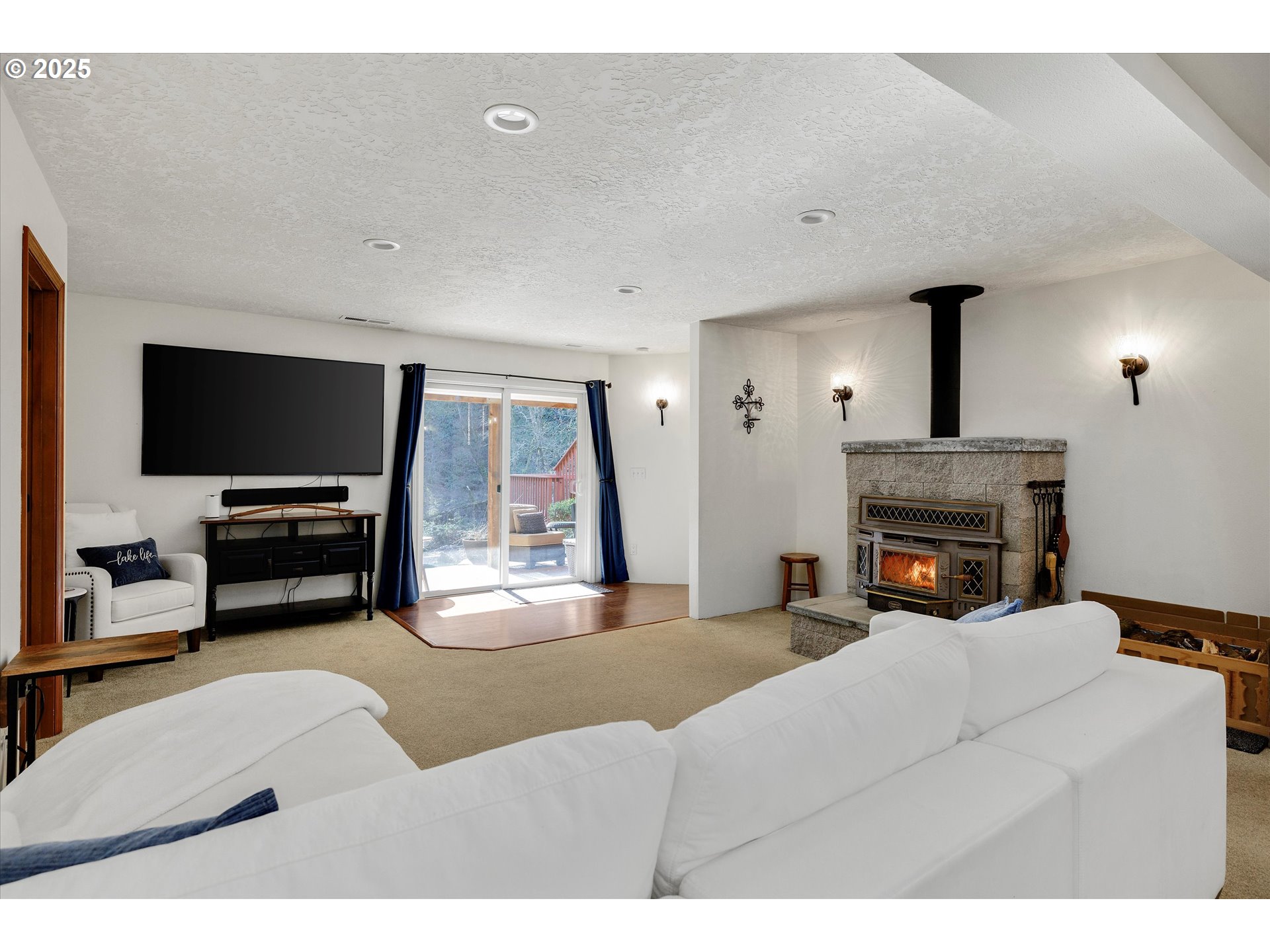 15451 Southeast Woodland Heights Road Amity, OR 97101 - Photo 23 of 48 a living room with furniture and a flat screen tv