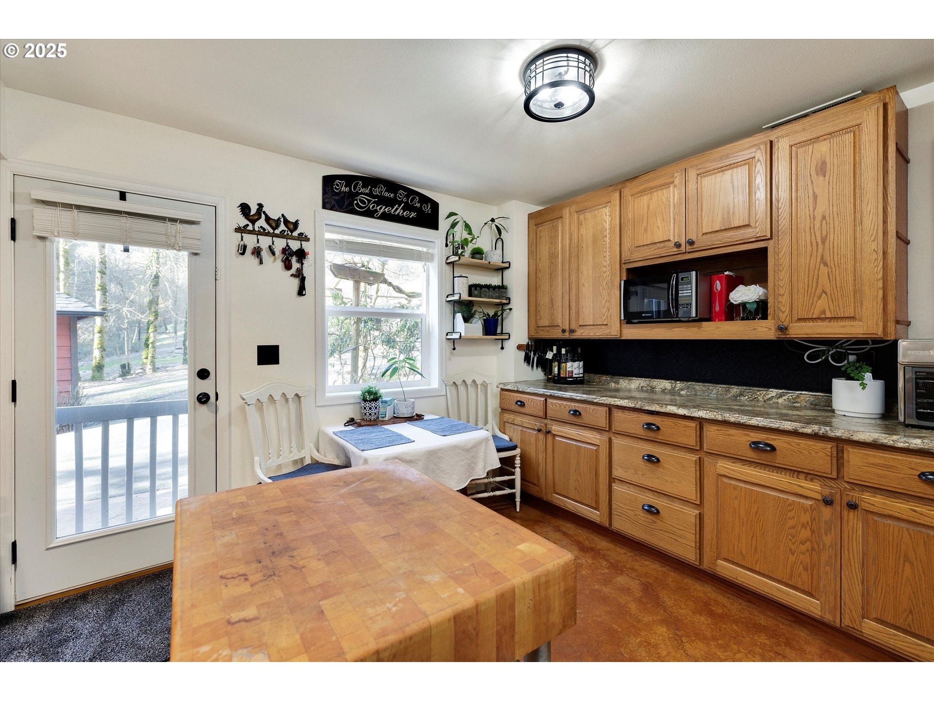 15451 Southeast Woodland Heights Road Amity, OR 97101 - Photo 27 of 48 a kitchen with a appliances cabinets and a window
