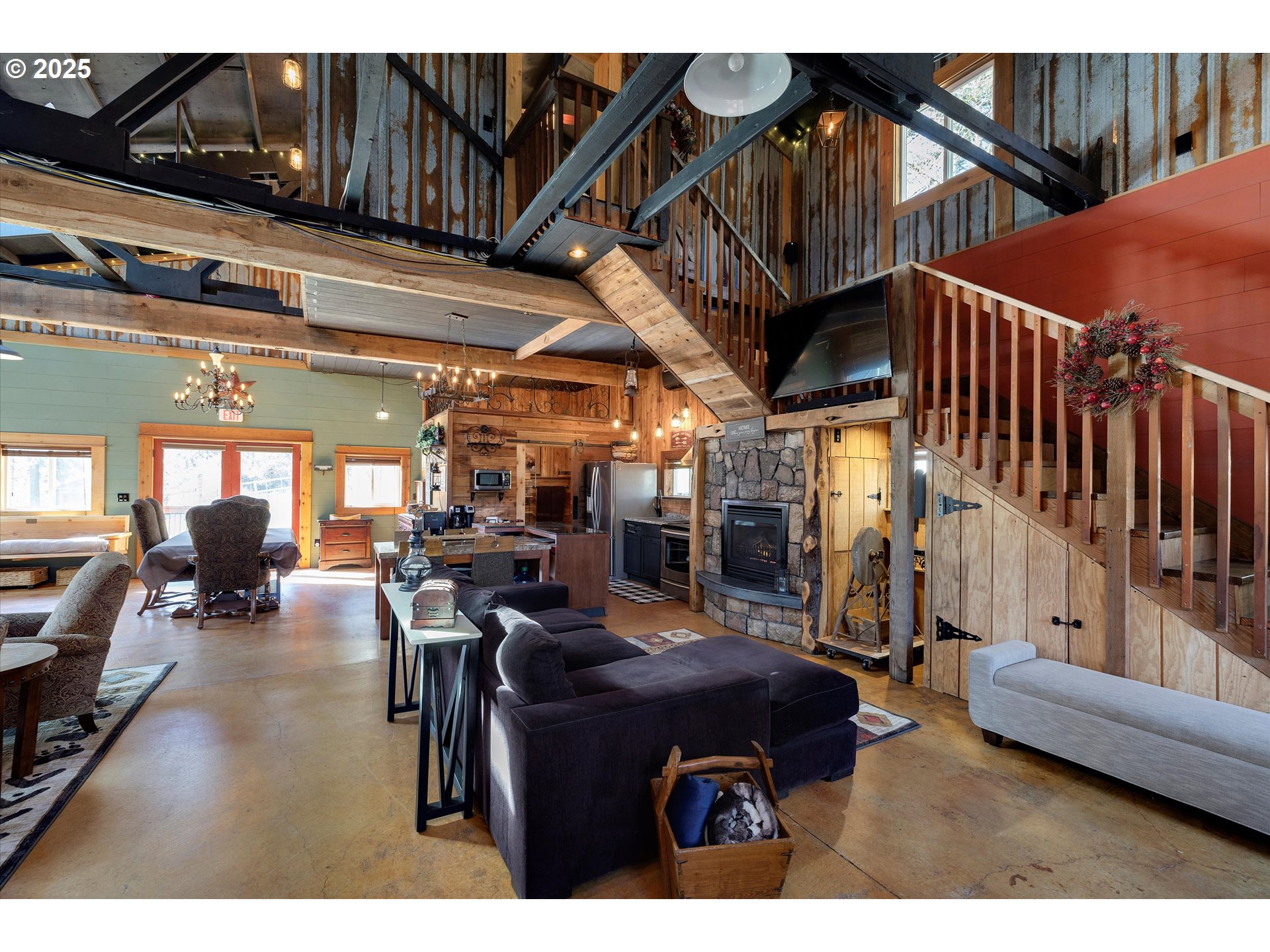 15451 Southeast Woodland Heights Road Amity, OR 97101 - Photo 32 of 48 a living room with lots of furniture and clutter