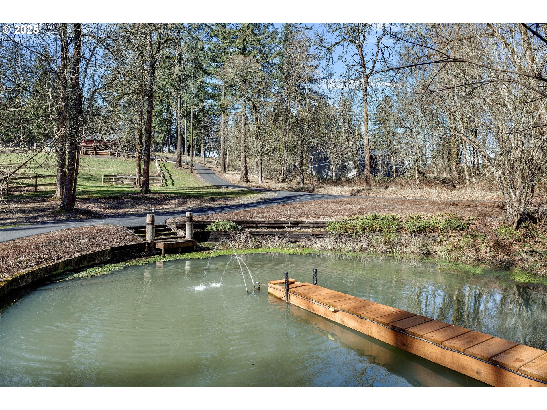 15451 Southeast Woodland Heights Road Amity, OR 97101 - Photo 4 of 48 a view of a lake with trees