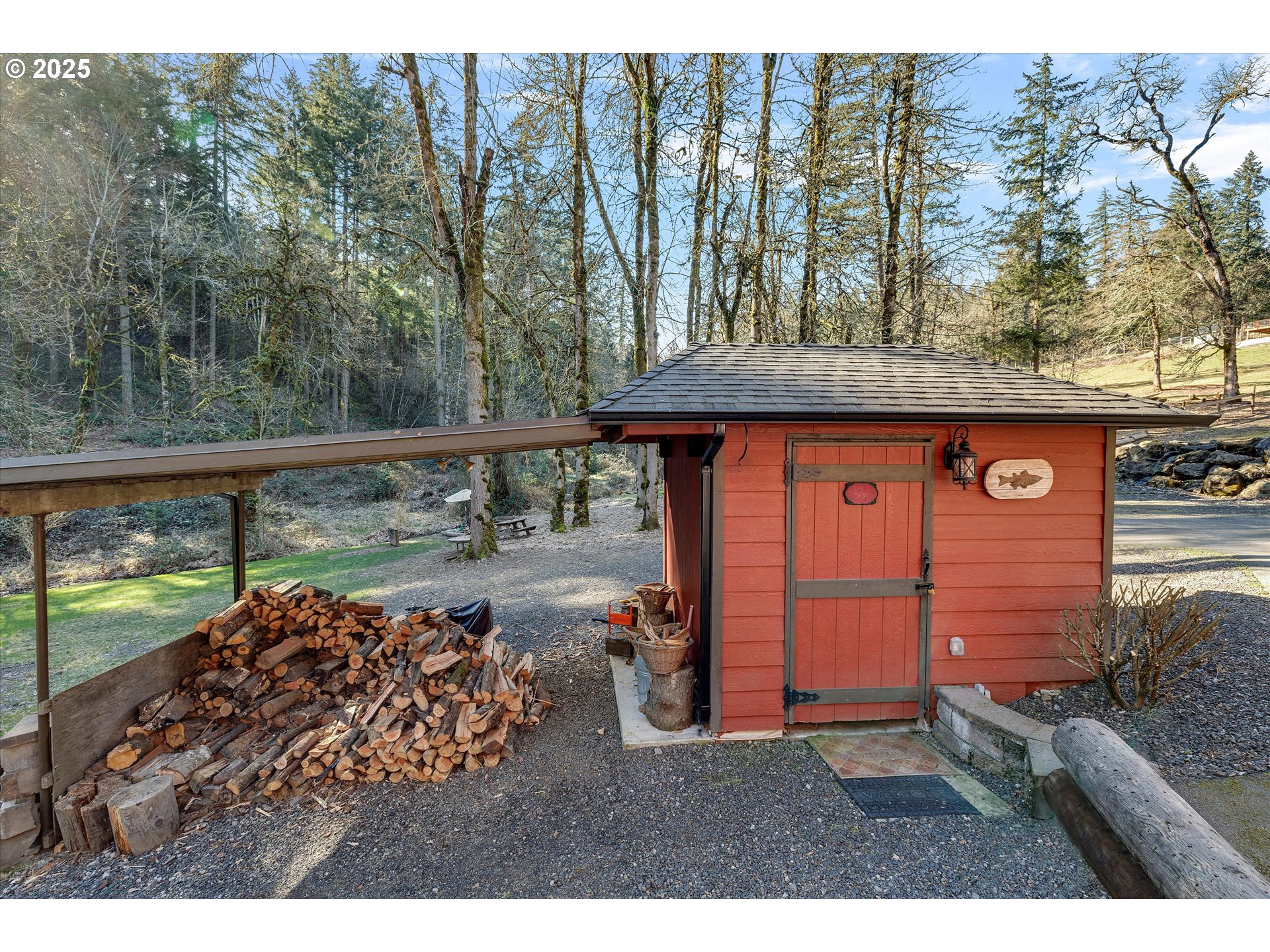 15451 Southeast Woodland Heights Road Amity, OR 97101 - Photo 43 of 48 a view of a backyard with table and chairs