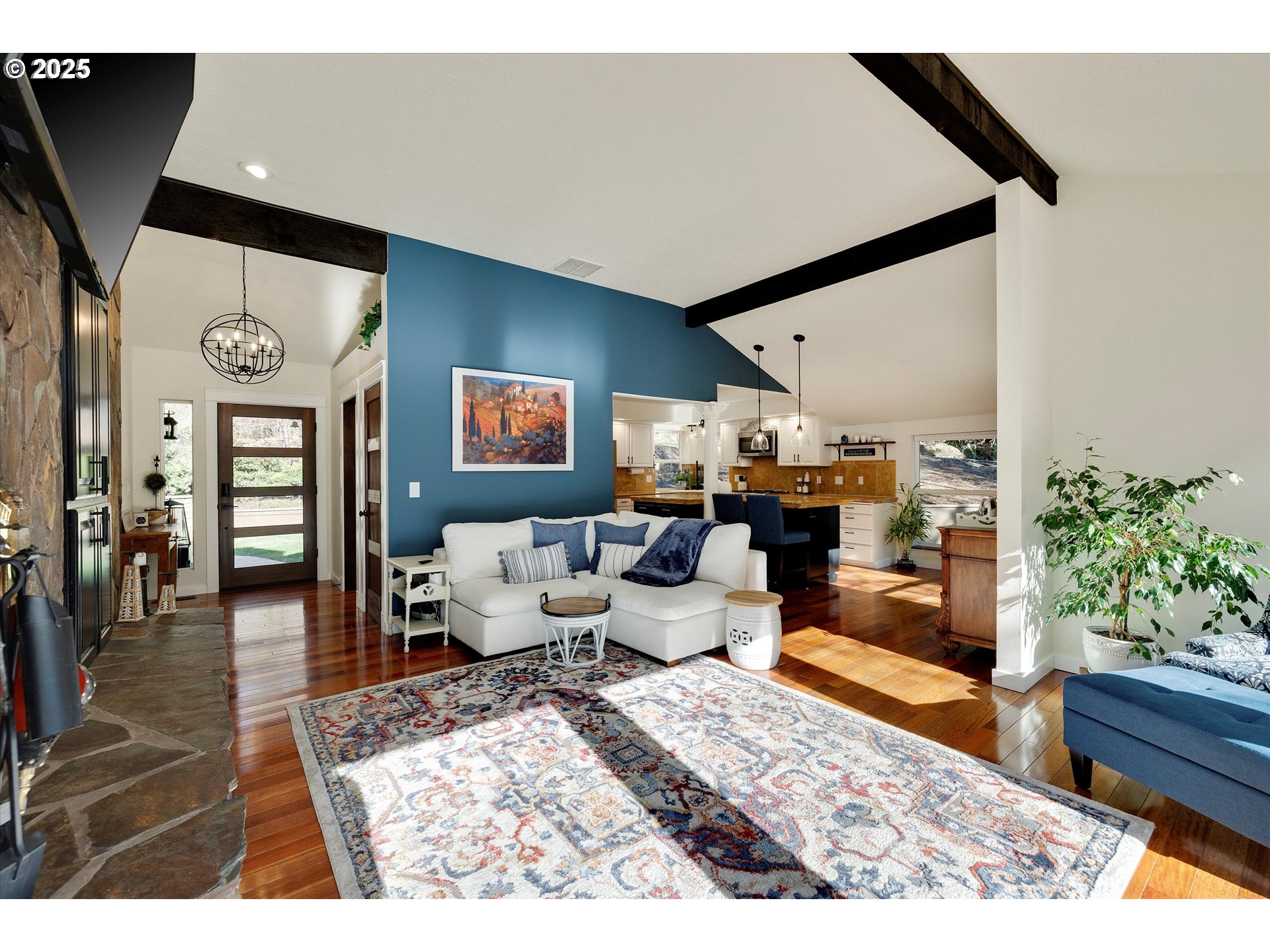 15451 Southeast Woodland Heights Road Amity, OR 97101 - Photo 8 of 48 a living room with furniture wooden floor and a potted plant