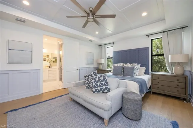 a spacious bedroom with a bed and window