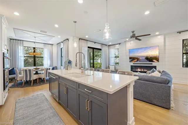 a large kitchen with a table and chairs