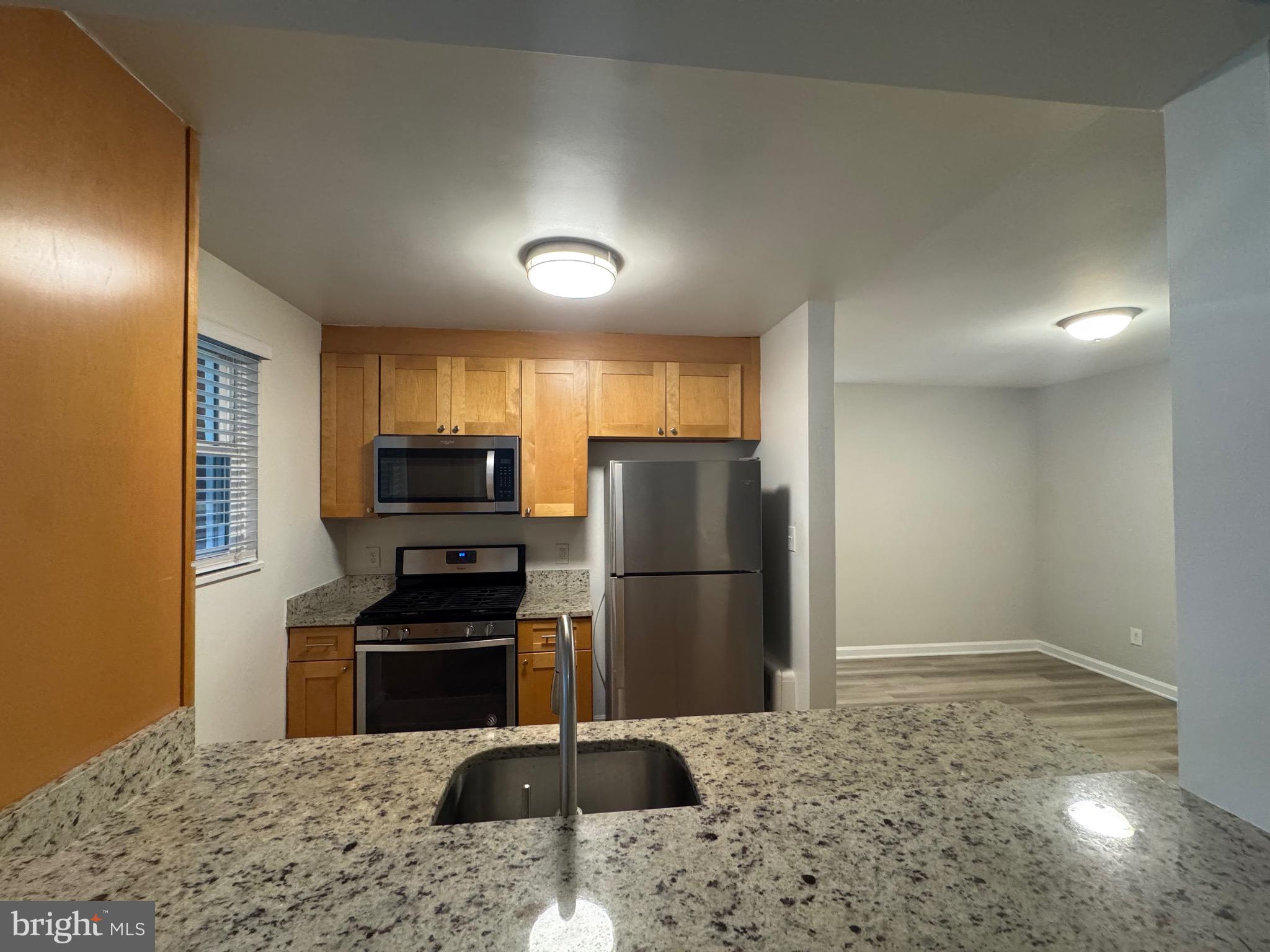 500 South Courthouse Road, Unit 5 Arlington, VA 22204 - Photo 9 of 16 a kitchen with a refrigerator and a sink