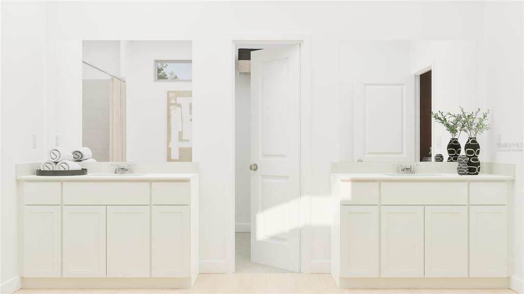 5653 Banyan Bay Road St. Cloud, FL 34771 - Photo 22 of 29 a bathroom with a sink and a mirror