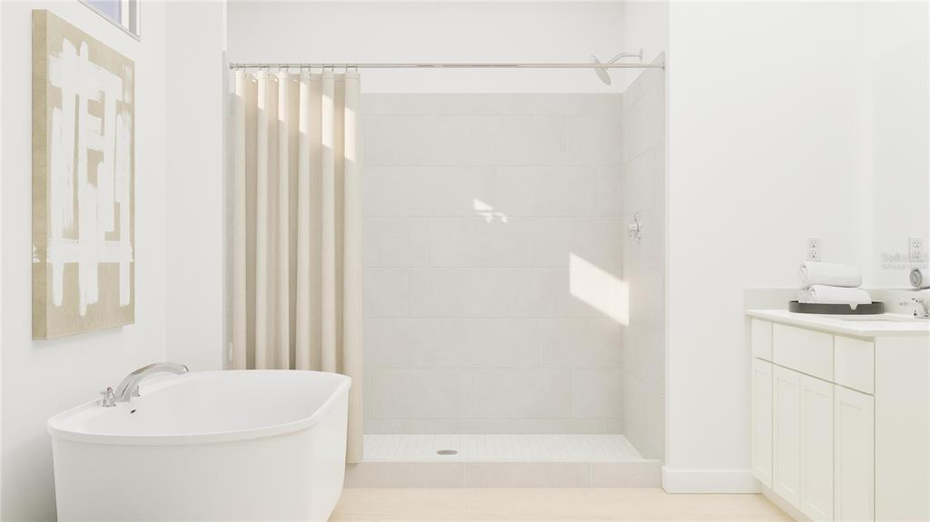 5653 Banyan Bay Road St. Cloud, FL 34771 - Photo 23 of 29 a bathroom with a shower a mirror and a sink