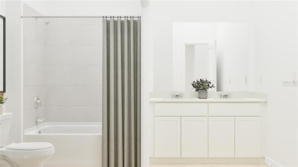 5653 Banyan Bay Road St. Cloud, FL 34771 - Photo 8 of 29 a bathroom with a bathtub and a sink