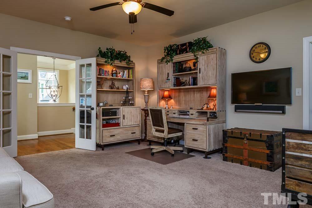 8103 Dreamy Way Raleigh, NC 27613 - Photo 3 of 25 This spacious bonus room can easily be your work from home office with plenty of room to work and has beautiful french doors. The closet has an electrical outlet for technology.