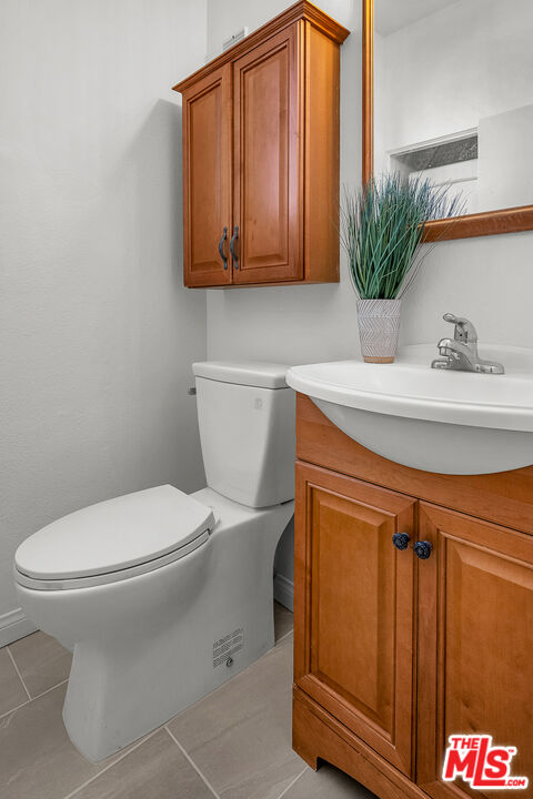 8162 Manitoba Street, Unit 202 Playa del Rey, CA 90293 - Photo 17 of 34 a bathroom with a toilet a sink and mirror
