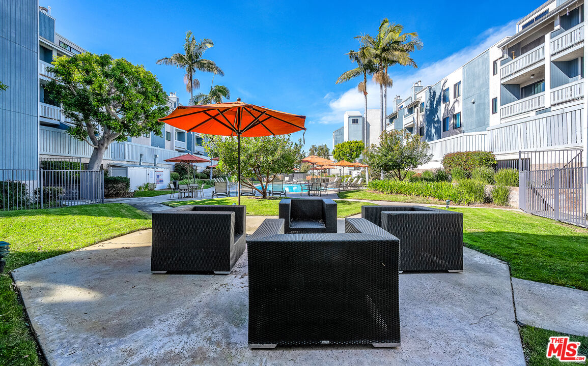 8162 Manitoba Street, Unit 202 Playa del Rey, CA 90293 - Photo 25 of 34 a view of yard with outdoor seating and green space