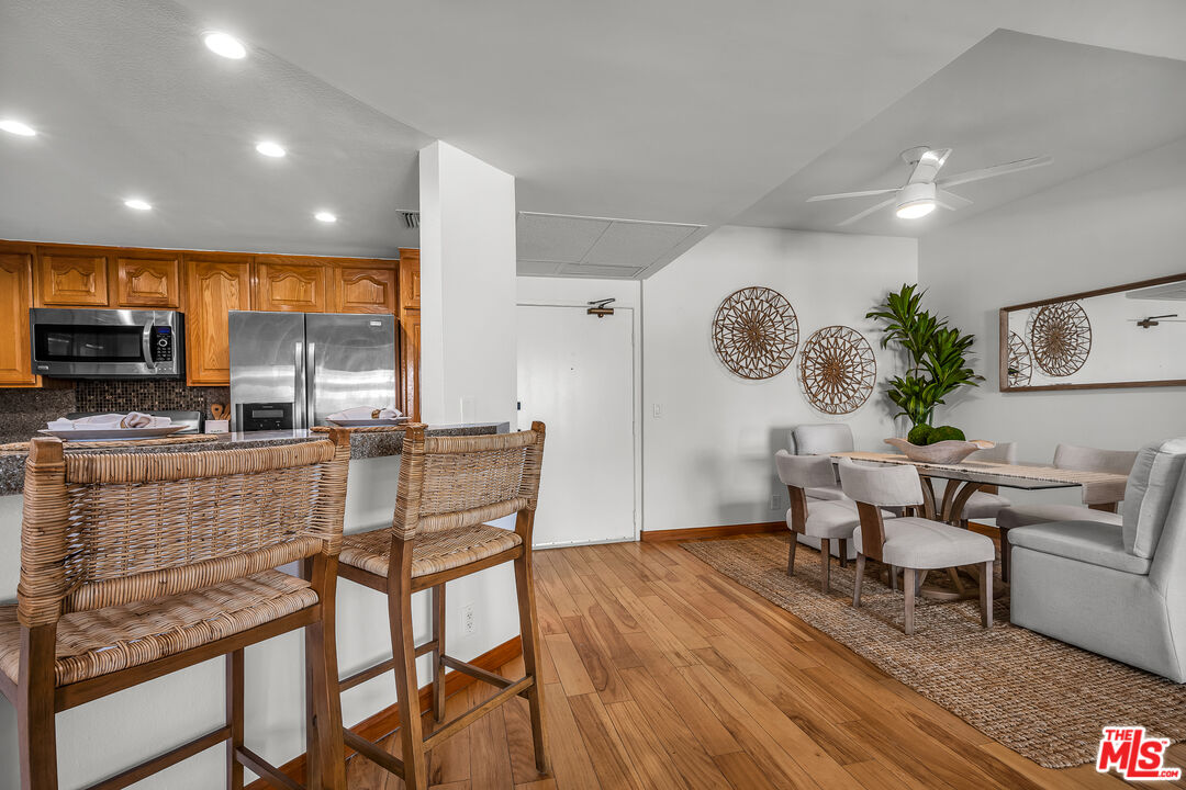 8162 Manitoba Street, Unit 202 Playa del Rey, CA 90293 - Photo 3 of 34 a living room with furniture a fireplace and a flat screen tv