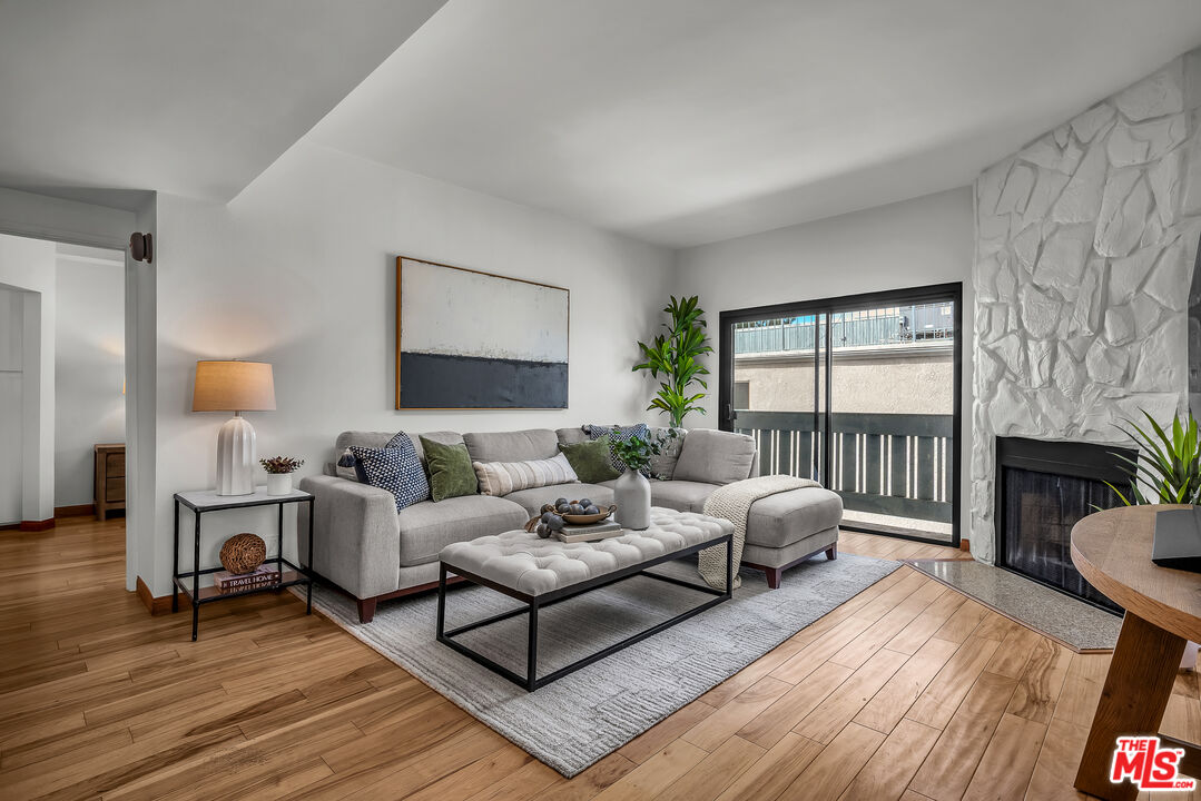 8162 Manitoba Street, Unit 202 Playa del Rey, CA 90293 - Photo 6 of 34 a living room with furniture and a window