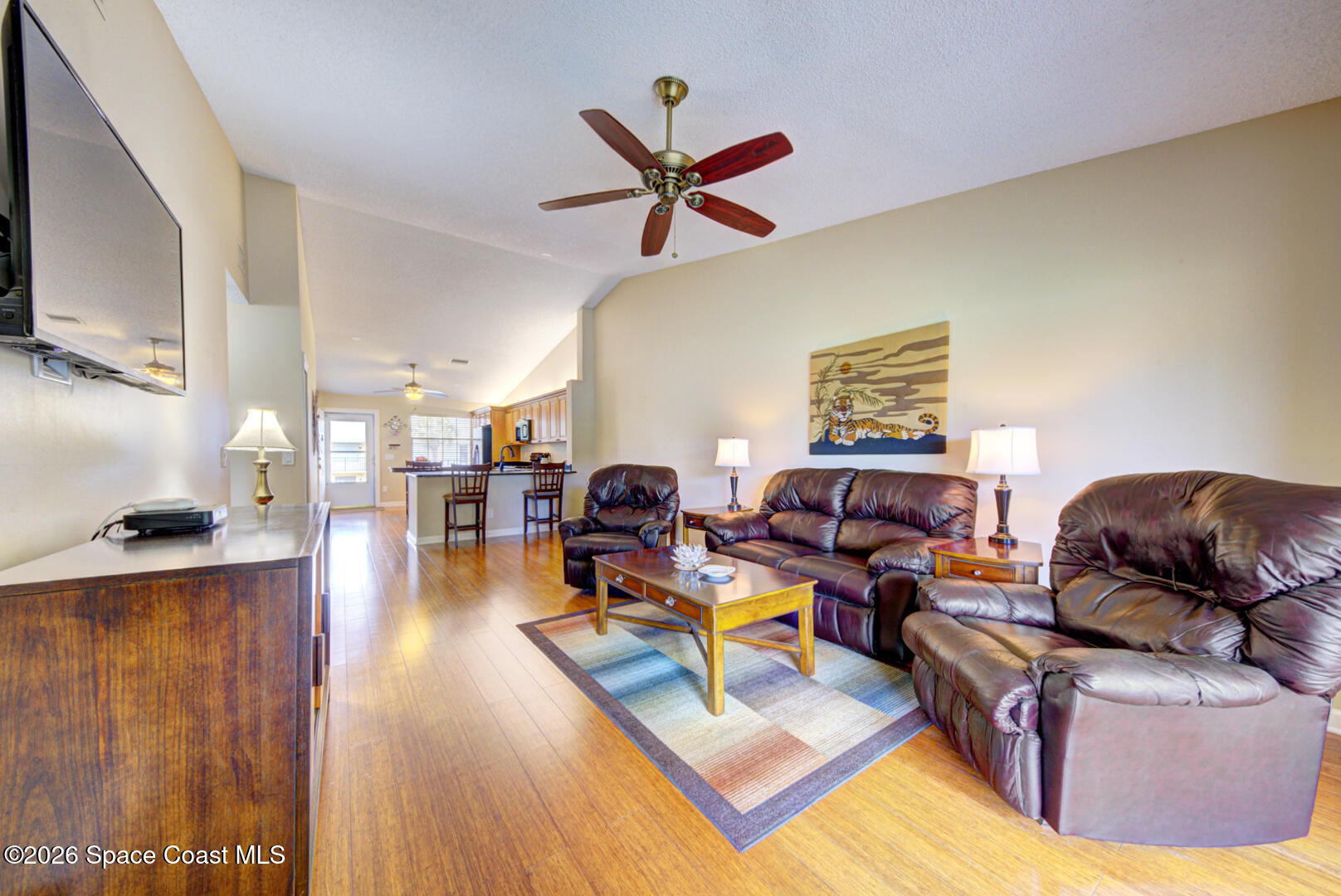 1142 Keystone Drive, Unit F Jupiter, FL 33458 - Photo 14 of 43 living room with vaulted ceiling
