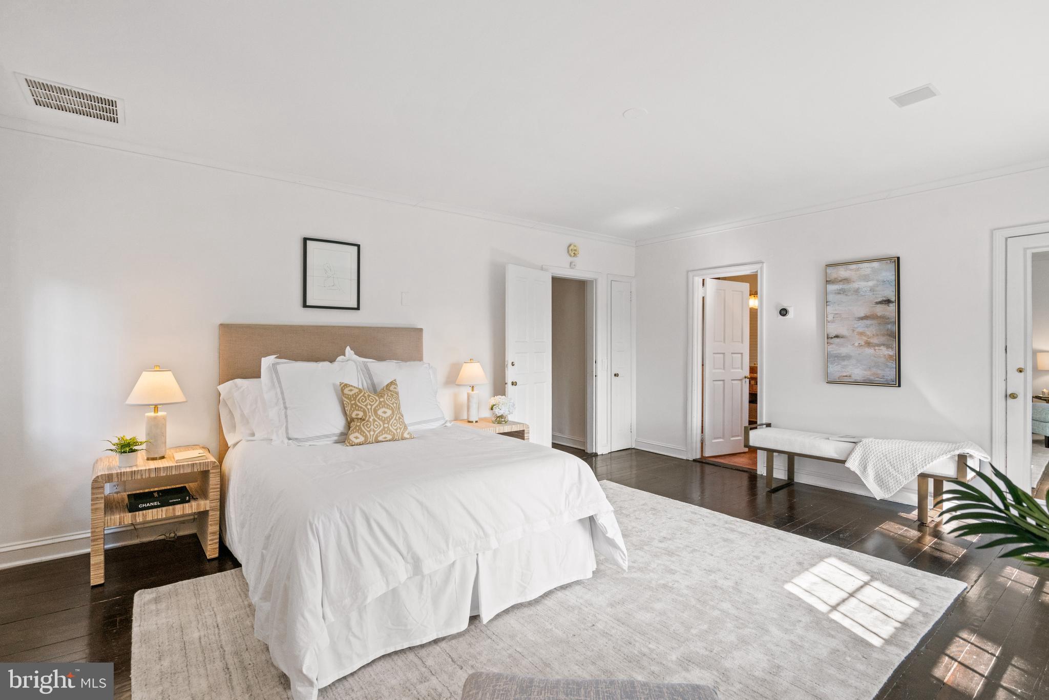 1698 32nd Street Northwest Washington, DC 20007 - Photo 16 of 29 a bedroom with a bed and wooden floor