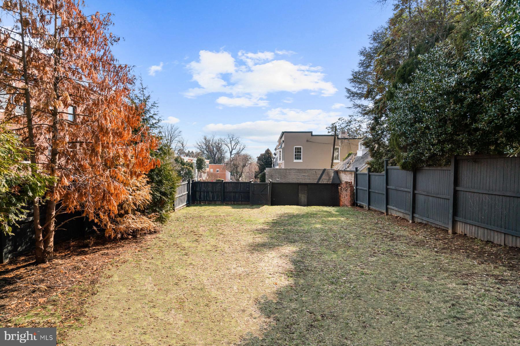 1698 32nd Street Northwest Washington, DC 20007 - Photo 26 of 29 a view of a house with a snow in the yard
