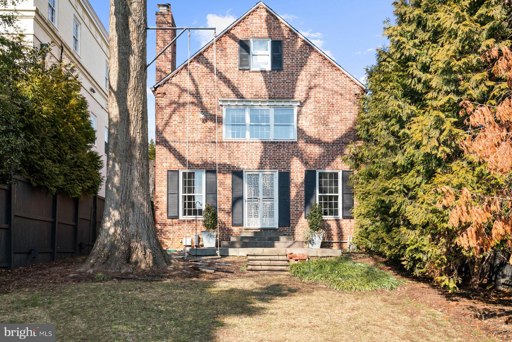 1698 32nd Street Northwest Washington, DC 20007 - Photo 27 of 29 a front view of a house with a yard