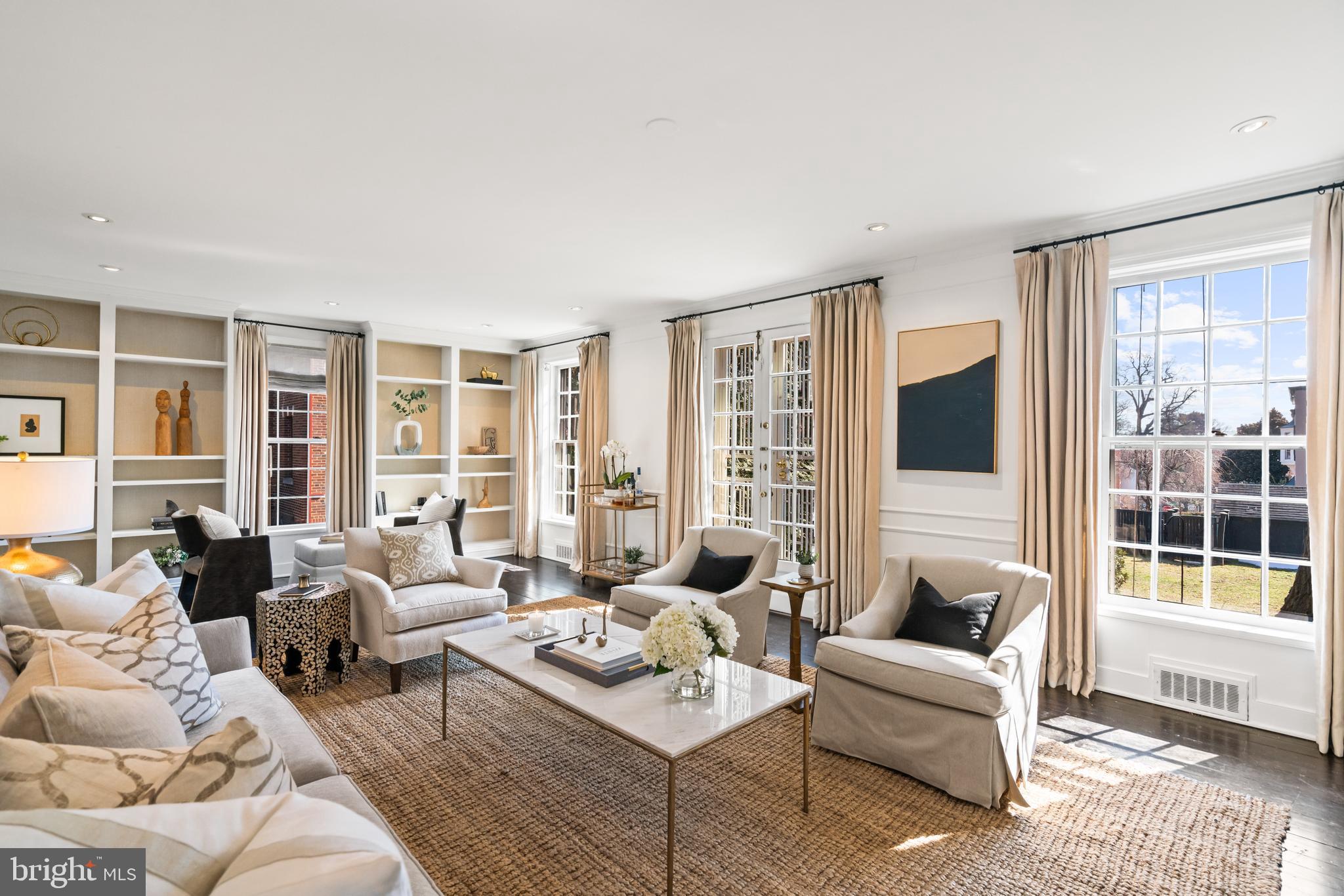 1698 32nd Street Northwest Washington, DC 20007 - Photo 6 of 29 a living room with furniture and large windows