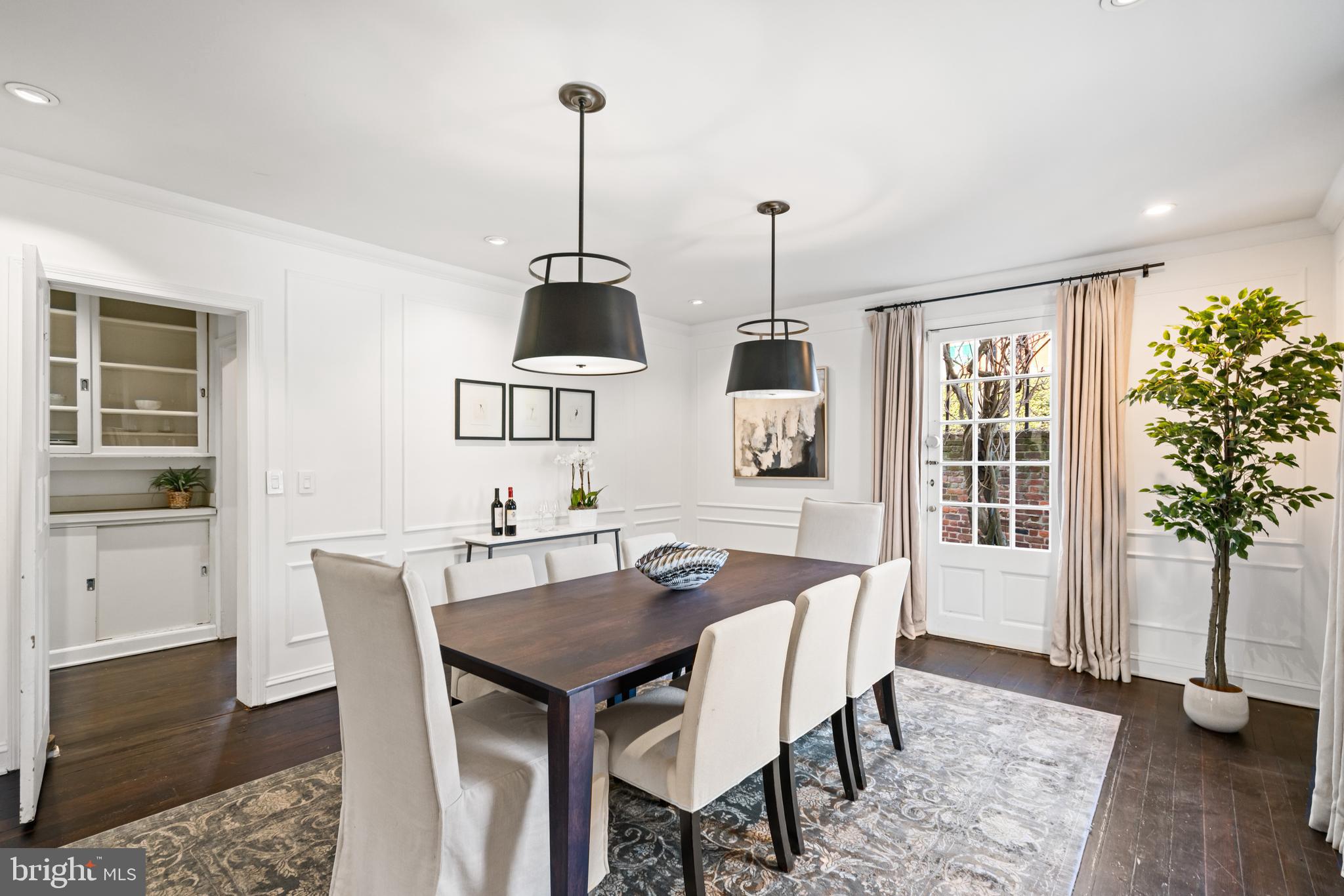1698 32nd Street Northwest Washington, DC 20007 - Photo 8 of 29 a view of a dining room with furniture window and wooden floor