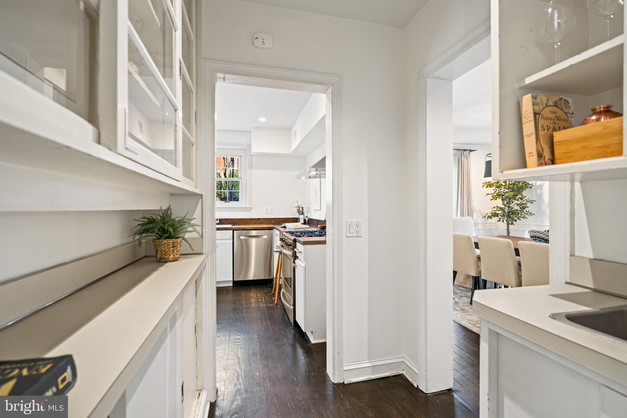 1698 32nd Street Northwest Washington, DC 20007 - Photo 9 of 29 a kitchen with a refrigerator and a stove