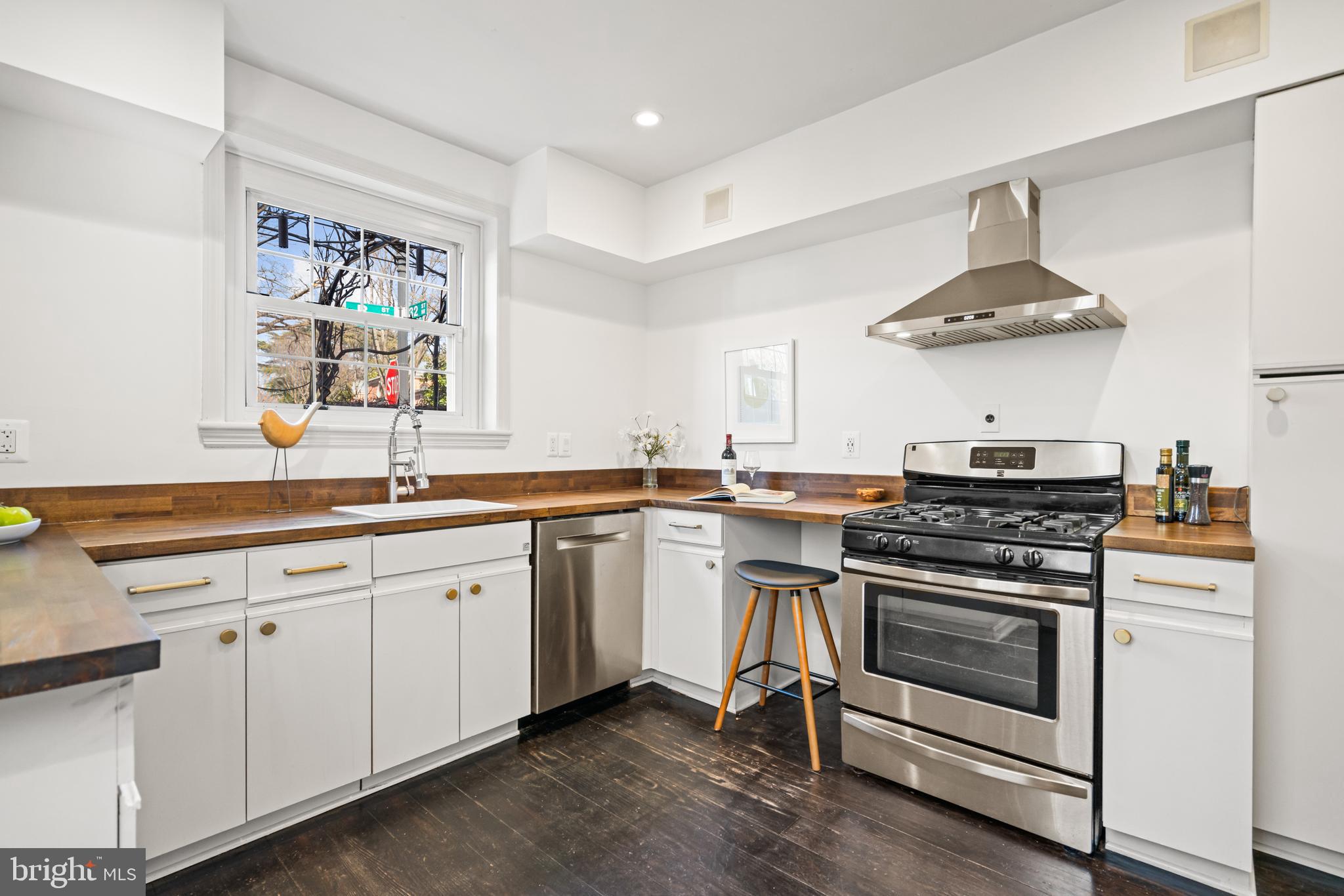 1698 32nd Street Northwest Washington, DC 20007 - Photo 10 of 29 a kitchen with a stove and a sink