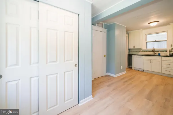 a view of a kitchen with granite countertop cabinets