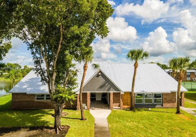 front view of a house with a yard