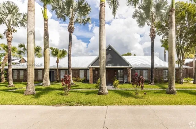 a view of residential houses with outdoor space and lake view
