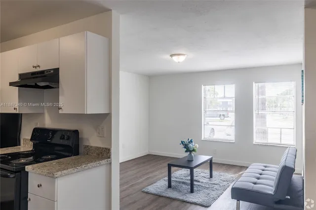 a living room with furniture and a window