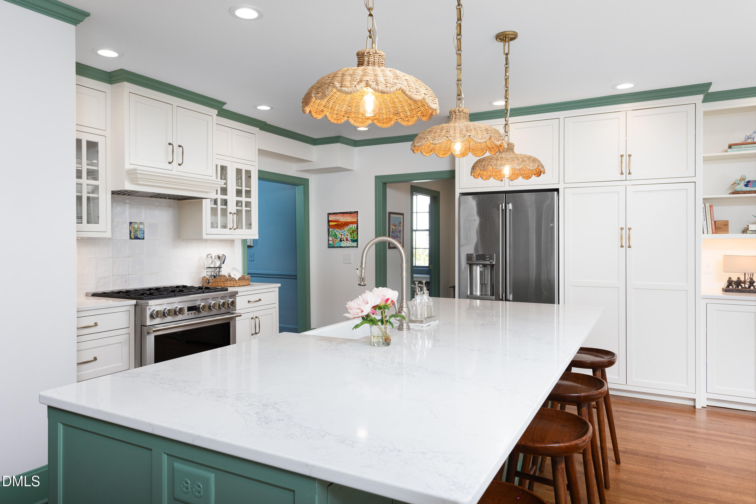 3433 Dover Road Durham, NC 27707 - Photo 16 of 56 a kitchen with a refrigerator a stove and white cabinets
