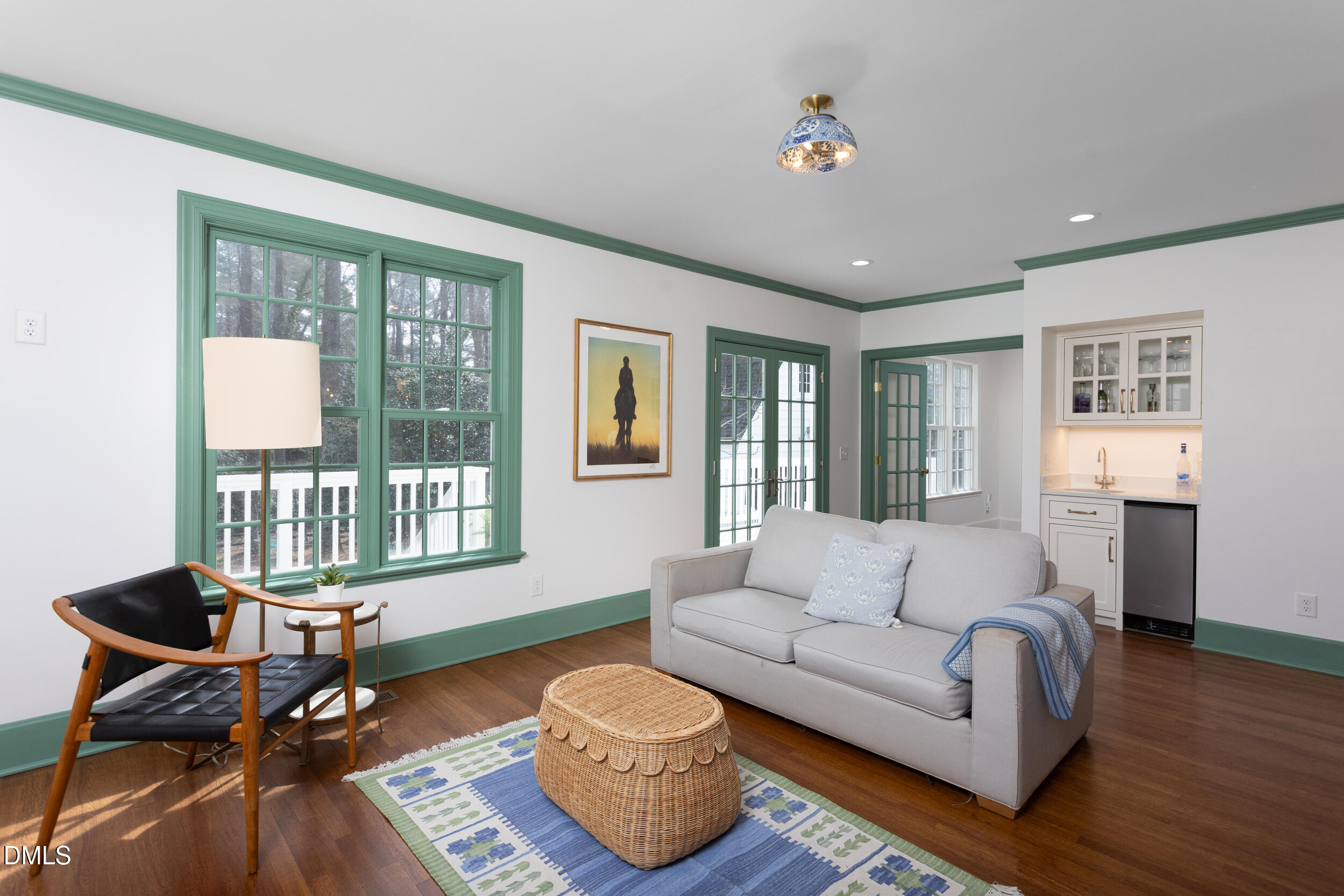 3433 Dover Road Durham, NC 27707 - Photo 19 of 56 a living room with furniture and floor to ceiling windows