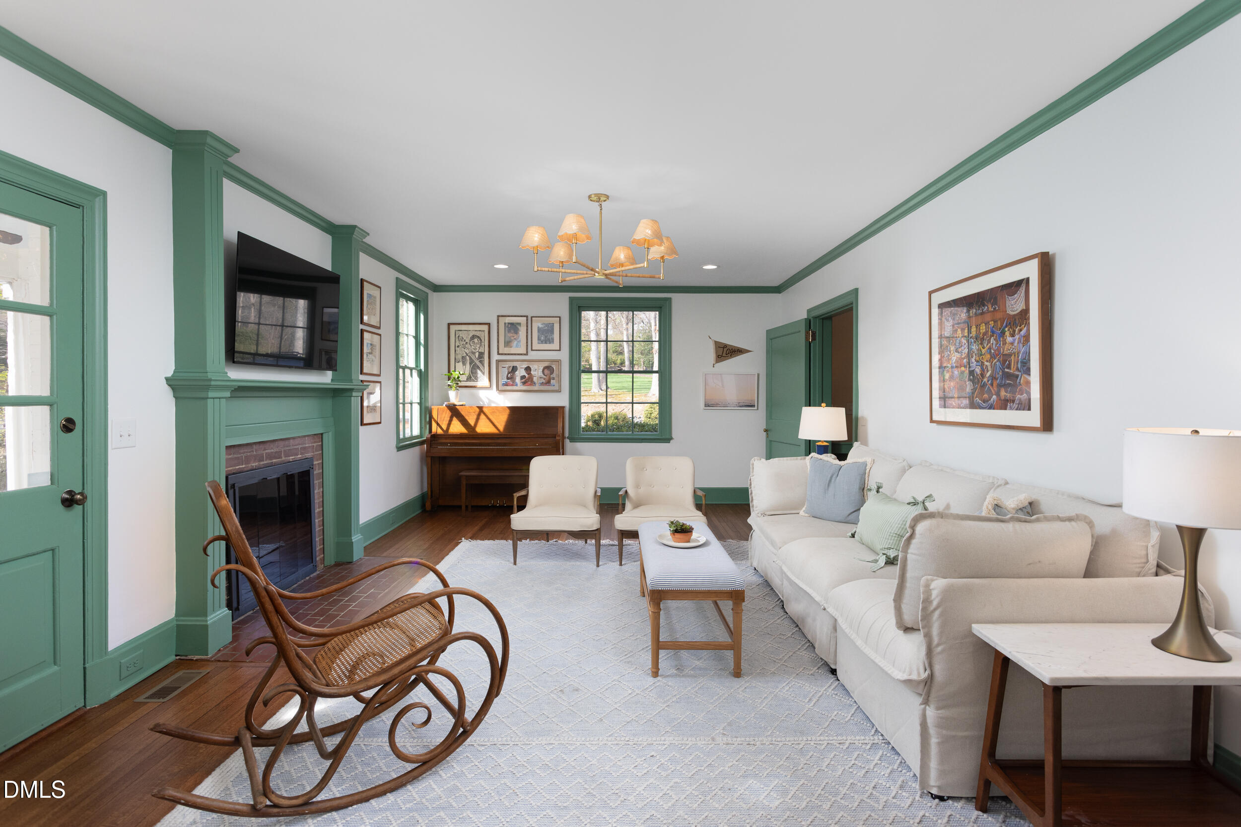 3433 Dover Road Durham, NC 27707 - Photo 20 of 56 a living room with furniture a fireplace and a flat screen tv