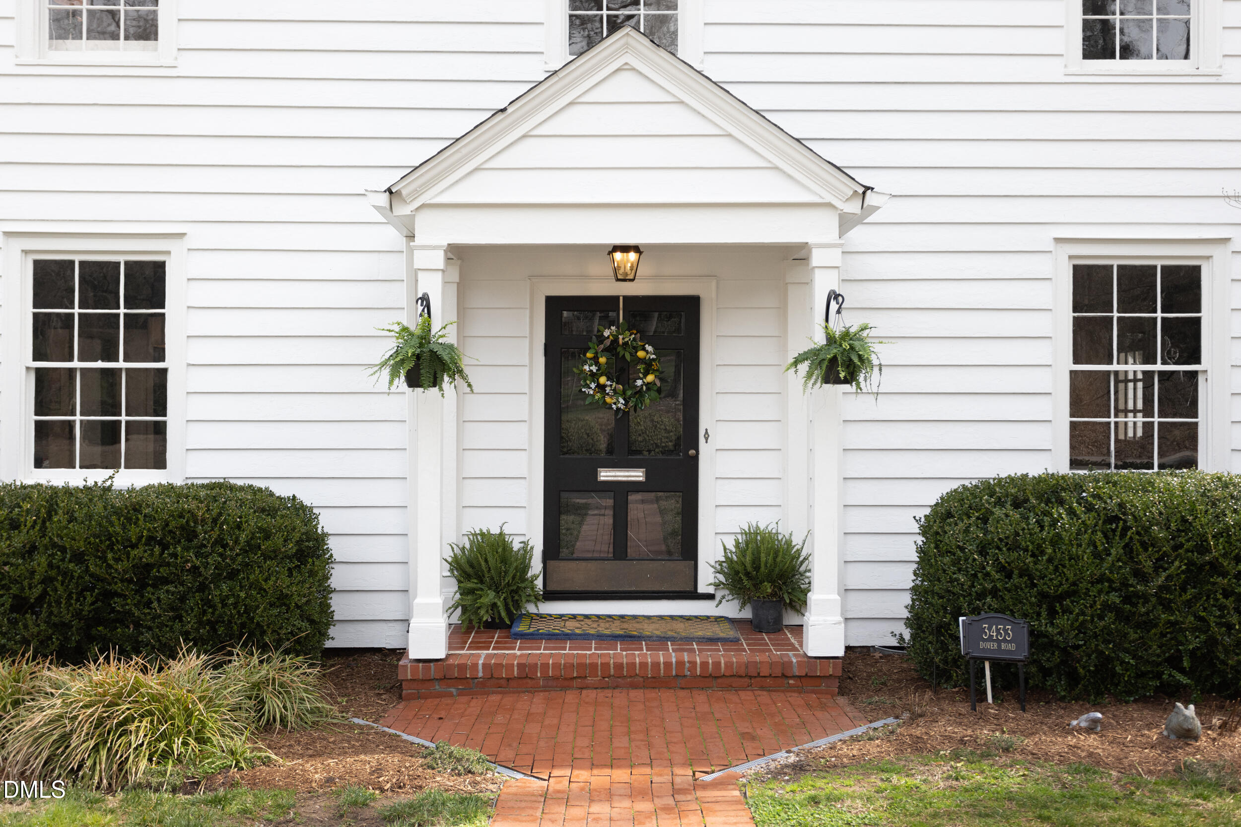 3433 Dover Road Durham, NC 27707 - Photo 3 of 56 a front view of a house with garden