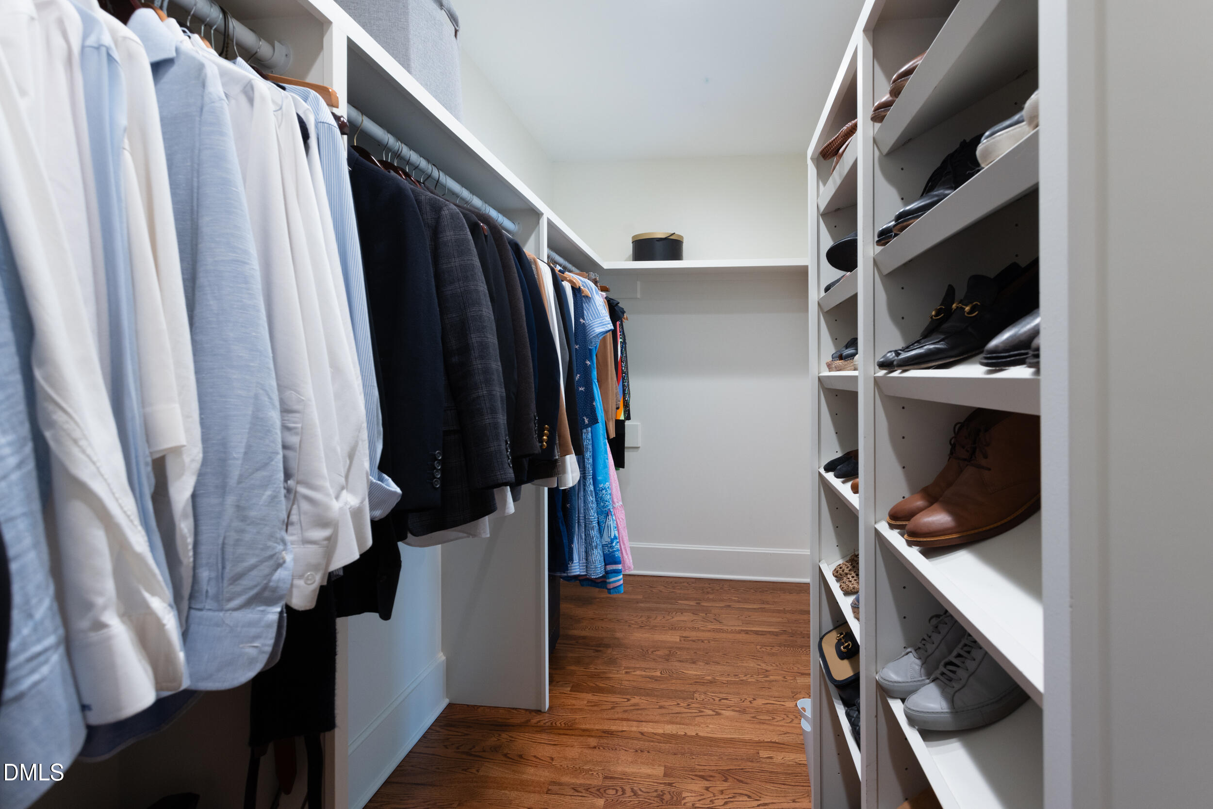 3433 Dover Road Durham, NC 27707 - Photo 42 of 56 a view of walk in closet with clothes and shoes