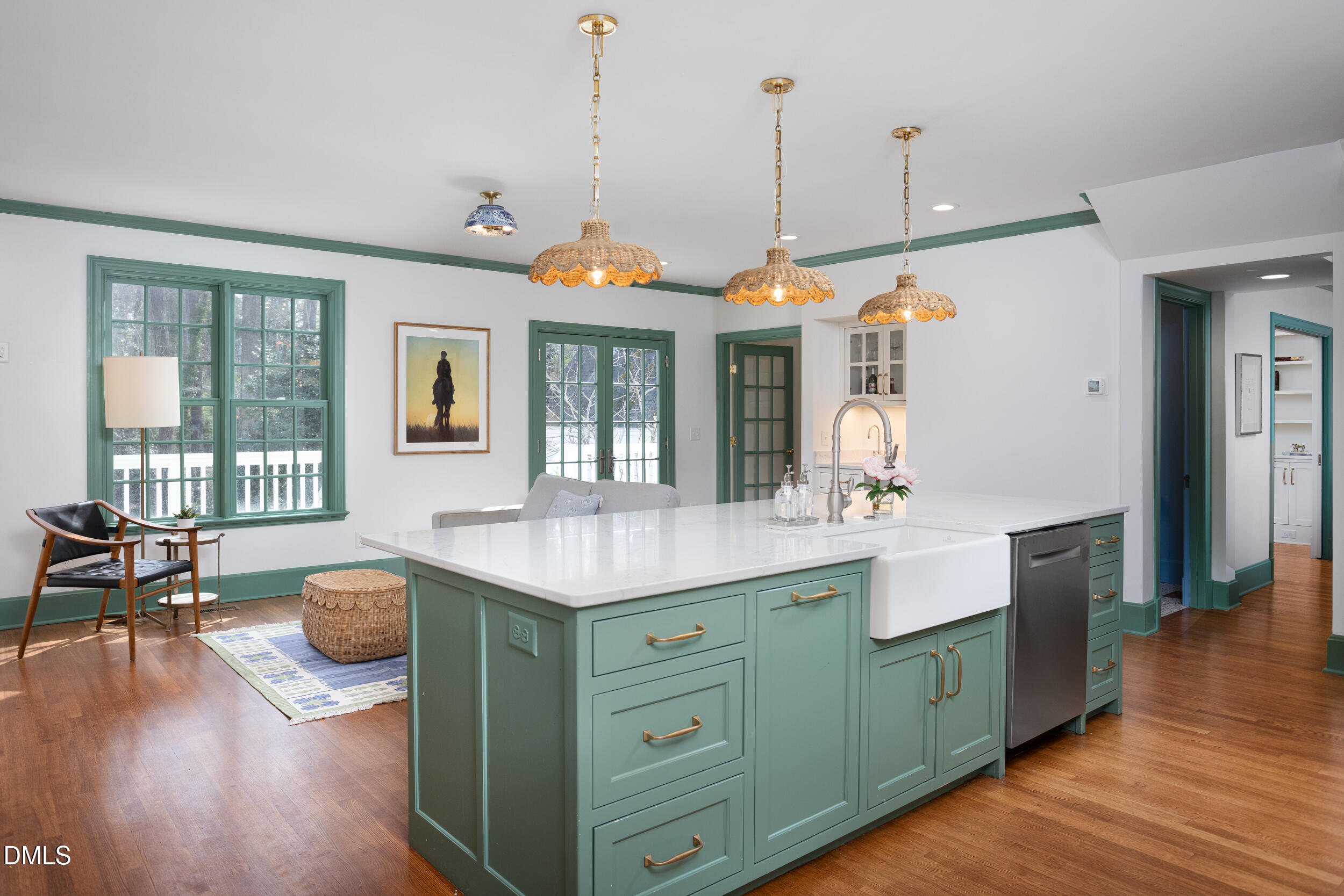 3433 Dover Road Durham, NC 27707 - Photo 8 of 56 a kitchen with a sink a counter and chairs in it