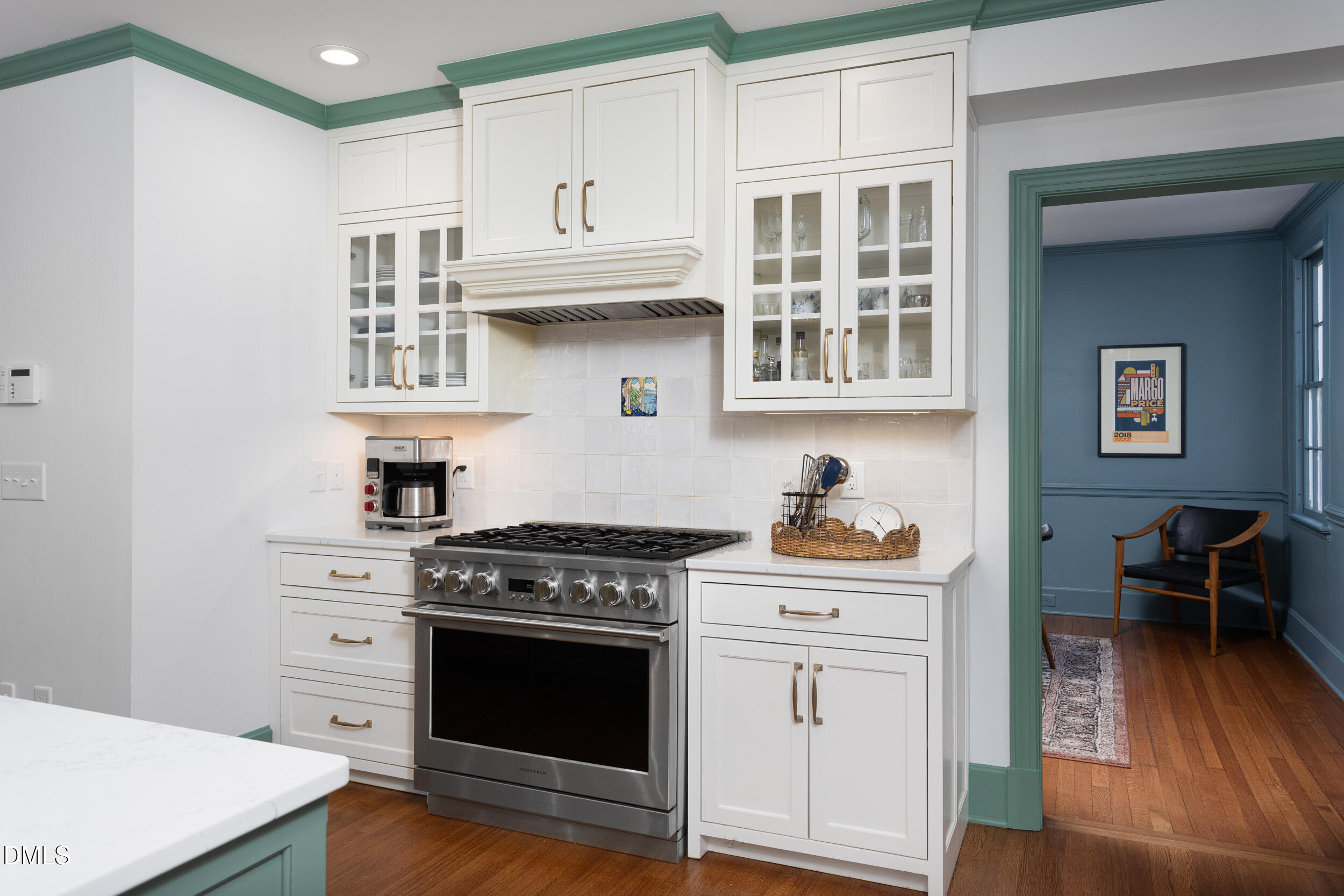 3433 Dover Road Durham, NC 27707 - Photo 9 of 56 a kitchen with stainless steel appliances granite countertop a stove and a wooden cabinets