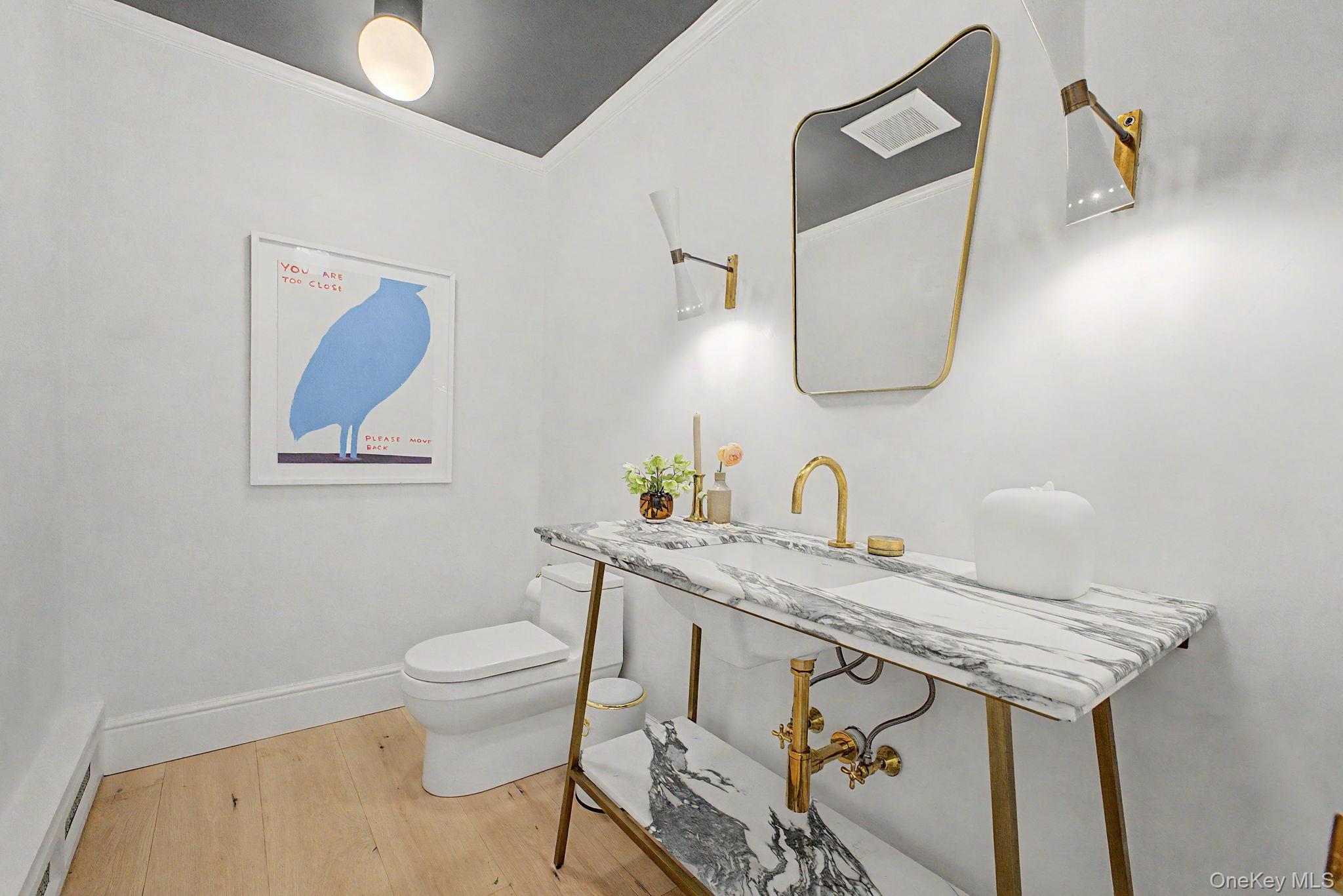 240 Eastwoods Road Pound Ridge, NY 10576 - Photo 26 of 46 a bathroom with a granite countertop sink a toilet and mirror