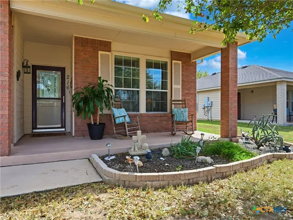 a front view of a house with porch and dining room