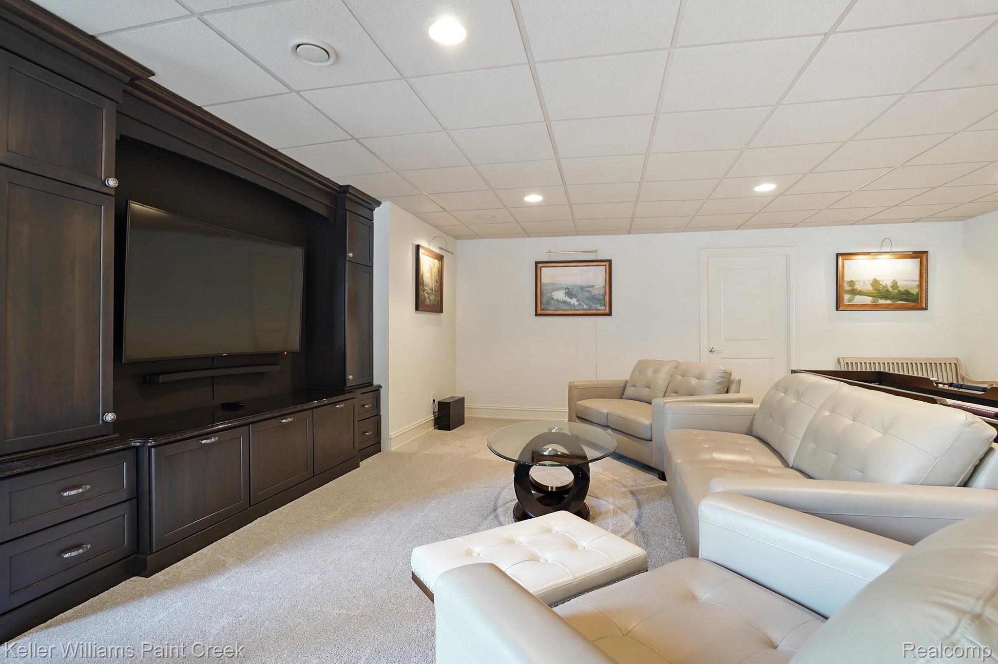 2772 North Addison Circle Rochester, MI 48306 - Photo 59 of 71 Custom built-in entertainment center with granite detail
