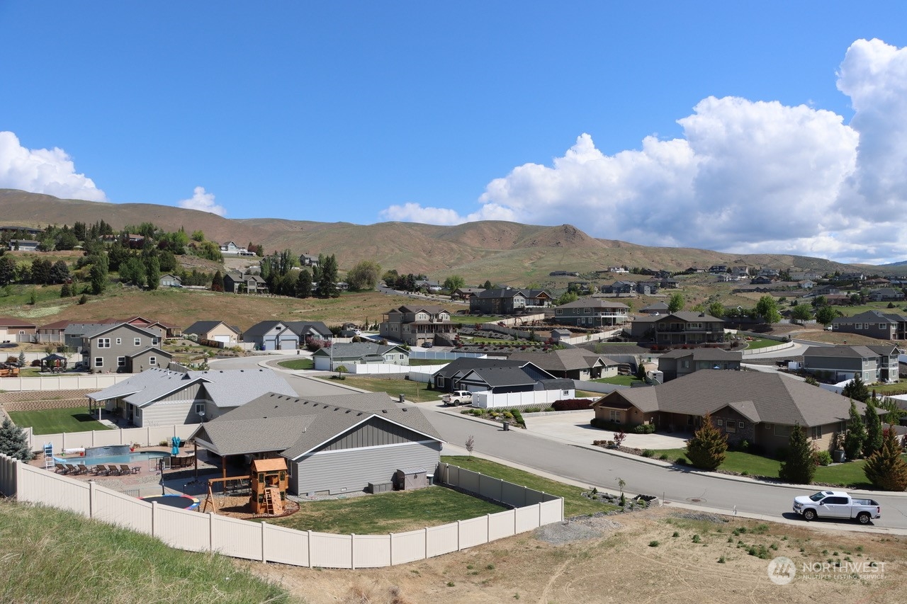 91 Sunny Meadows Loop Wenatchee, WA 98801 - Photo 11 of 17 a view of a swimming pool with lounge chairs