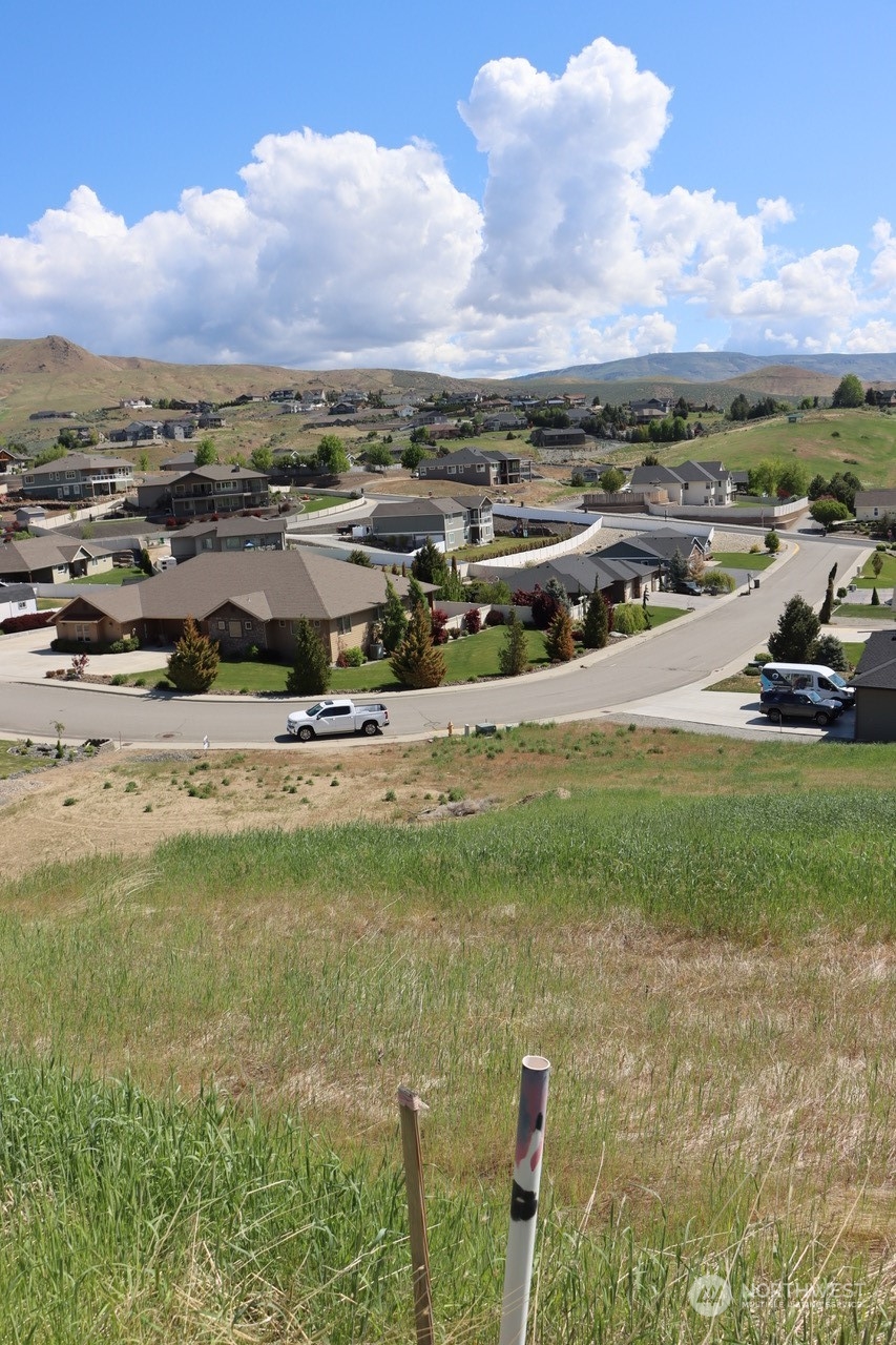 91 Sunny Meadows Loop Wenatchee, WA 98801 - Photo 9 of 17 a view of a lake with lawn chairs