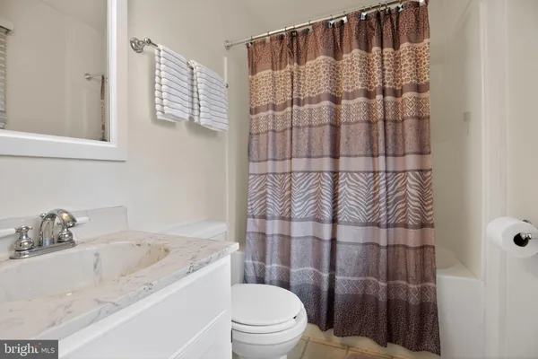 a bathroom with a bathtub and shower